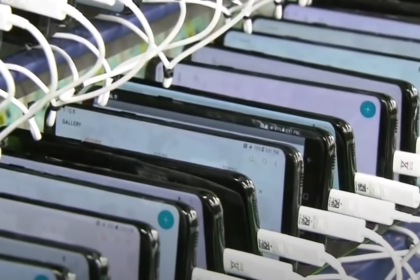 Phones lined up in a factory for charging