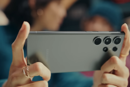 female hands with rings holding a phone