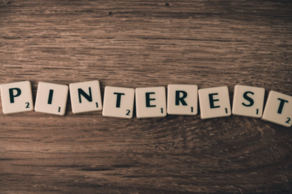 Pinterest letters on dark wooden table